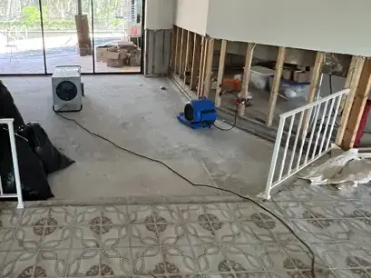 Air mover drying a room with walls opened above the flood line