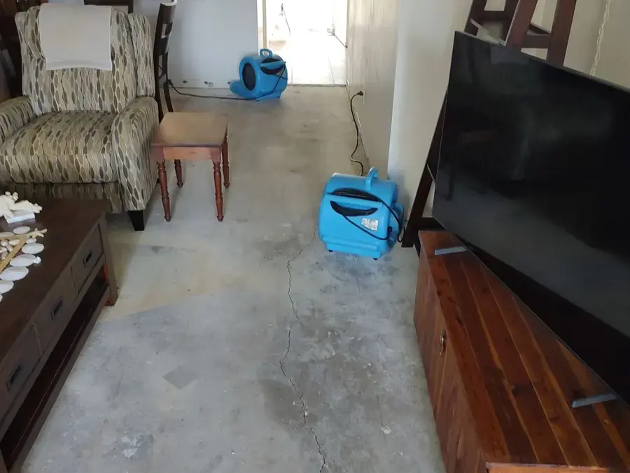 Air movers drying a Largo living room floor after a water loss